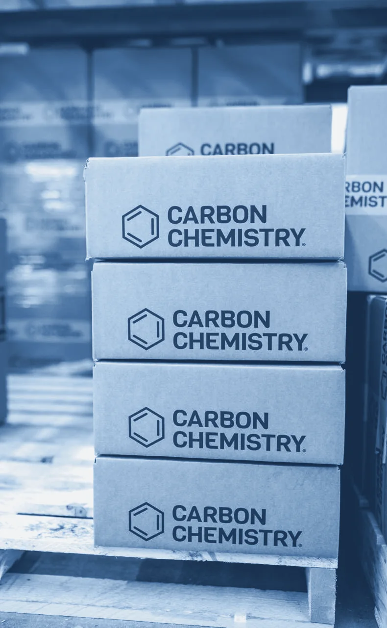 Carbon Chemistry cartons stacked on a pallet