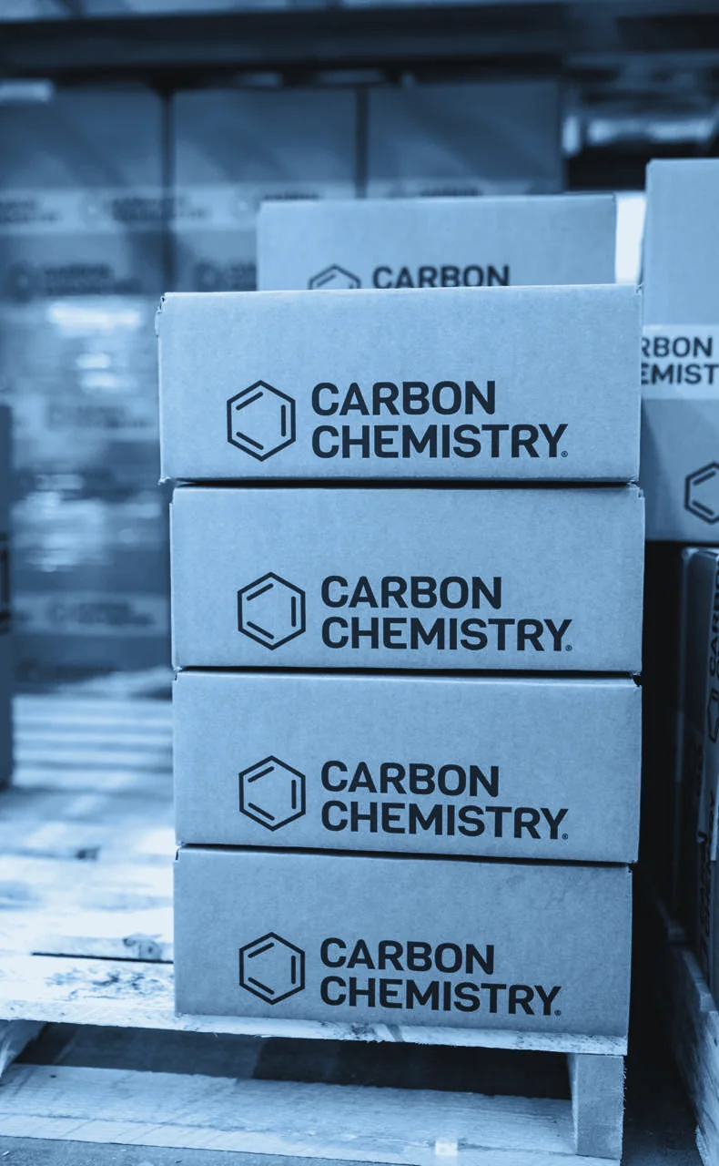 Carbon Chemistry cartons stacked on a pallet