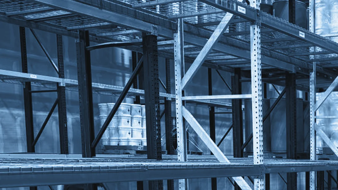 Racked pallet positions down a long warehouse aisle