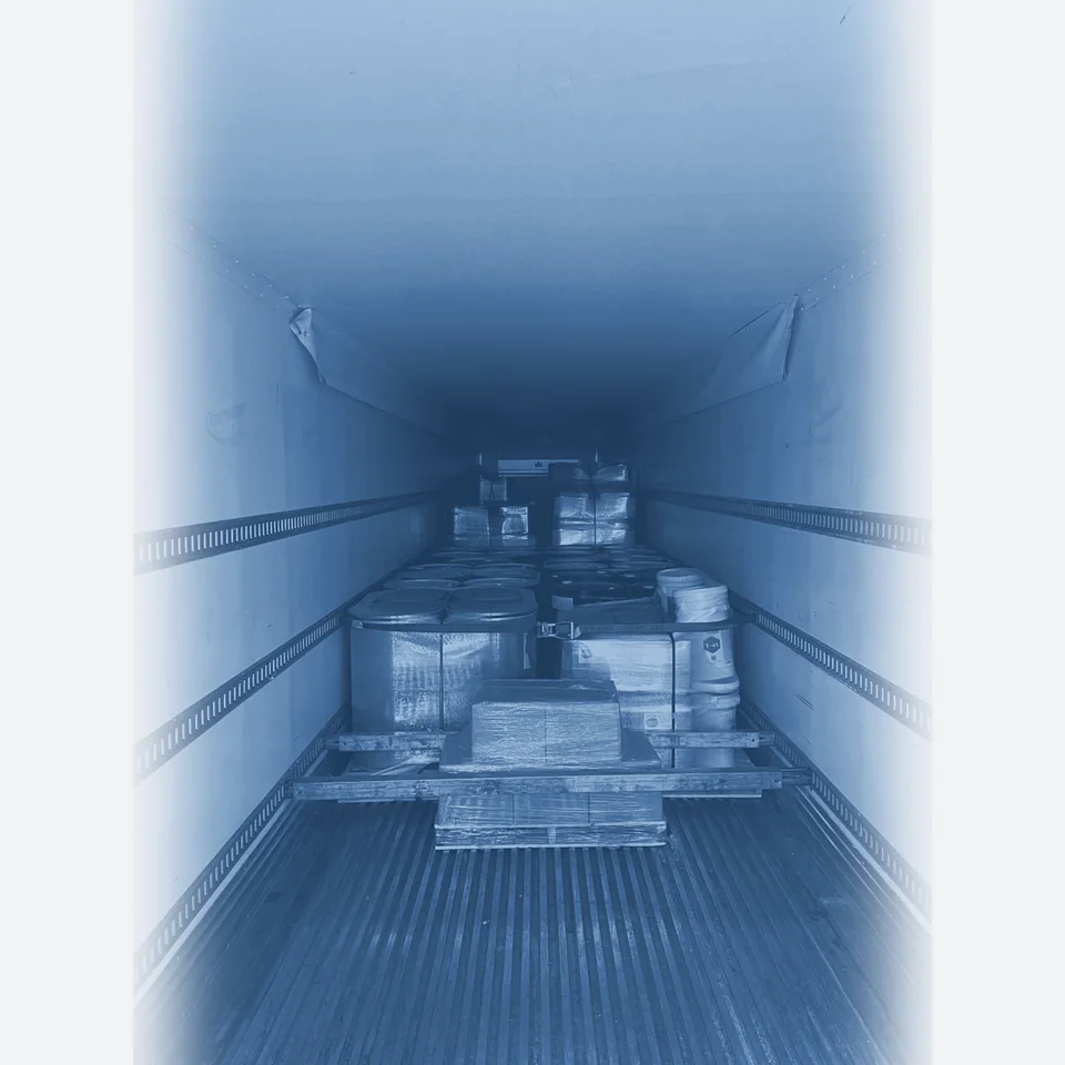 A trailer loaded with wrapped pallets at the dock